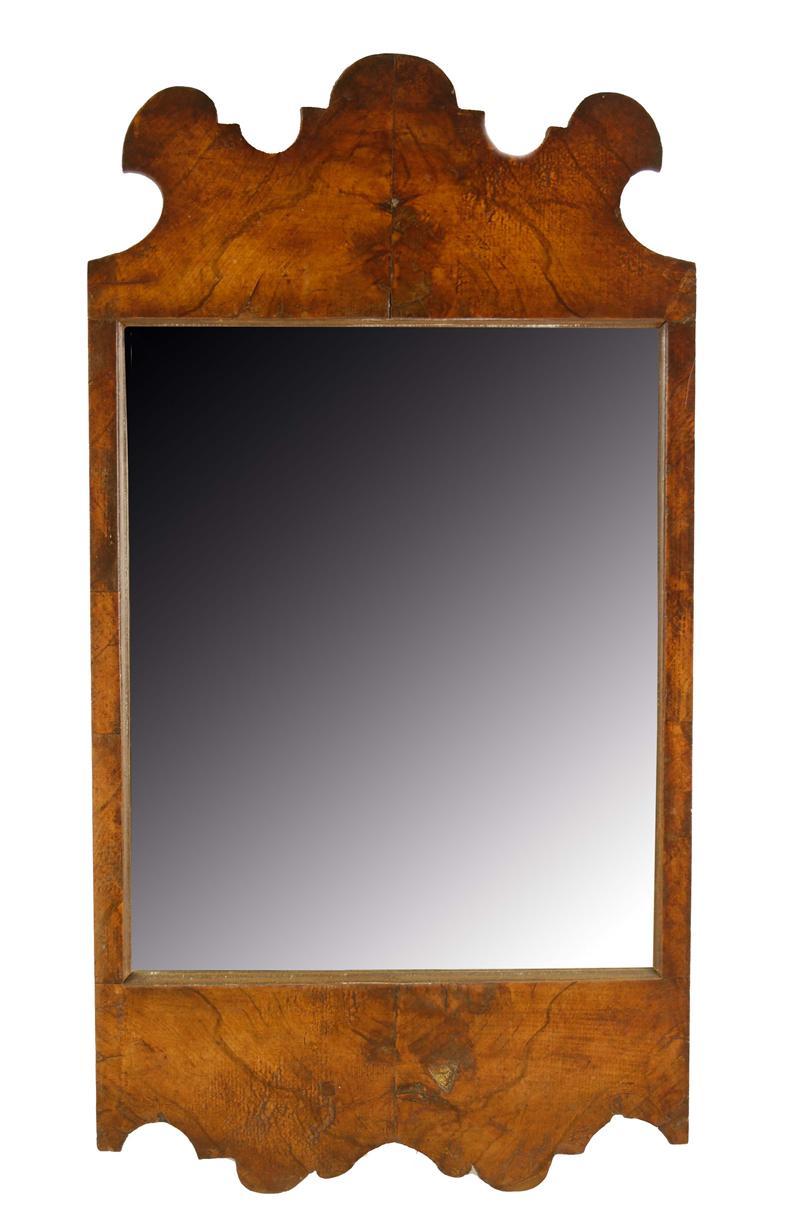 Appraisal: An th century walnut fret-frame wall mirror