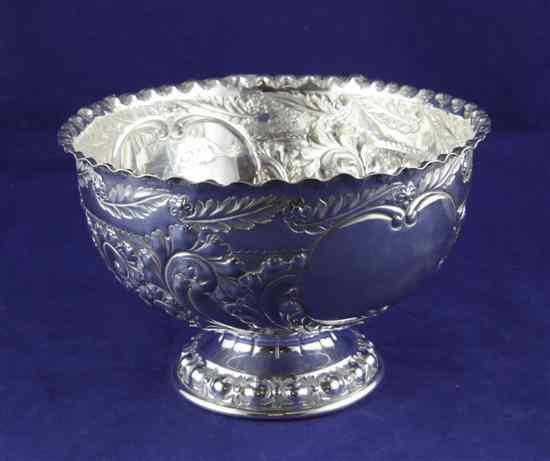 Appraisal: A late Victorian silver pedestal rose bowl embossed with scrolling