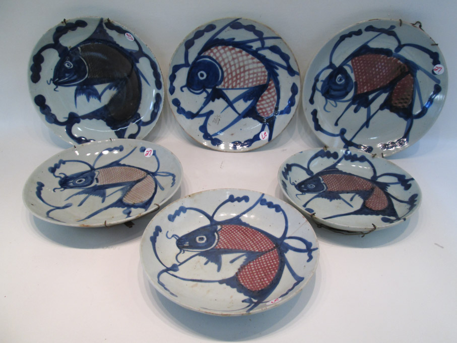 Appraisal: SIX CHINESE PORCELAIN FISH PLATES each depicting a red and