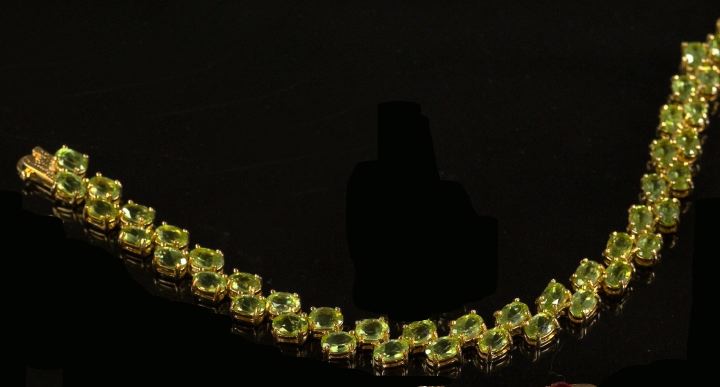 Appraisal: Peridot and Vermeil Bracelet featuring forty-two oval-cut peridots totaling carats