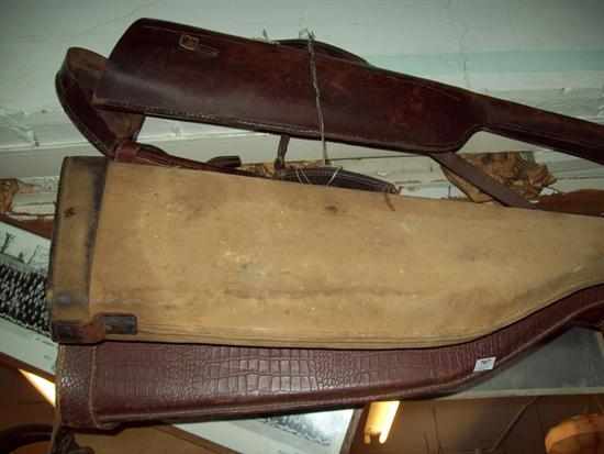 Appraisal: A COLLECTION OF FOUR ANTIQUE LEATHER AND CANVAS SHOT GUN