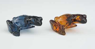 Appraisal: A Pair of Lalique Glass Frogs Charming amber and blue-grey