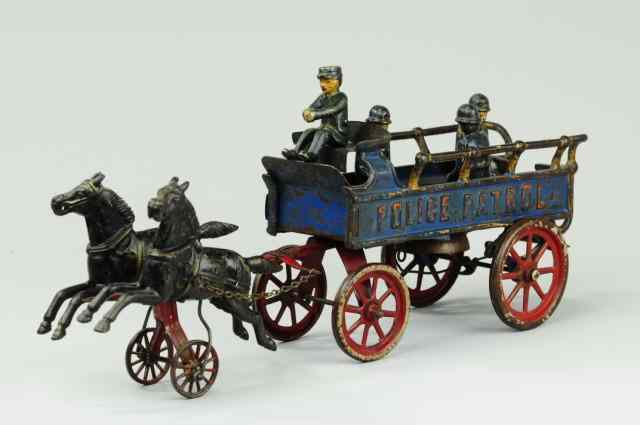 Appraisal: POLICE PATROL HORSE DRAWN WAGON Dent cast iron open bed