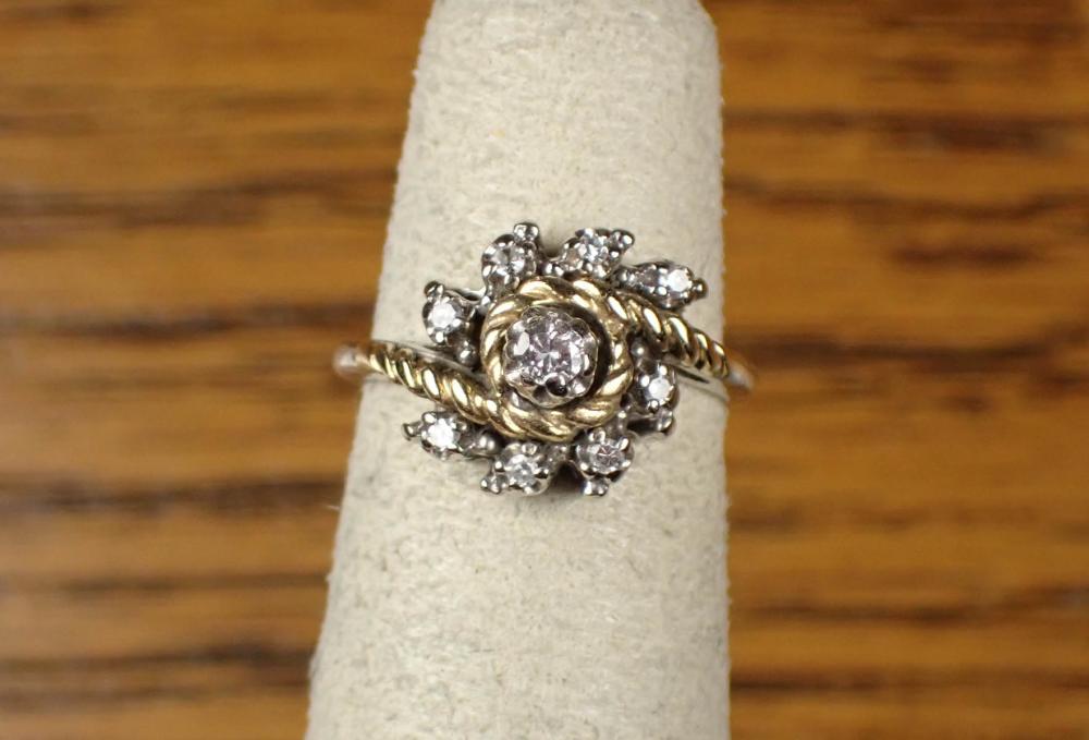 Appraisal: DIAMOND AND FOURTEEN KARAT GOLD RING The white and yellow