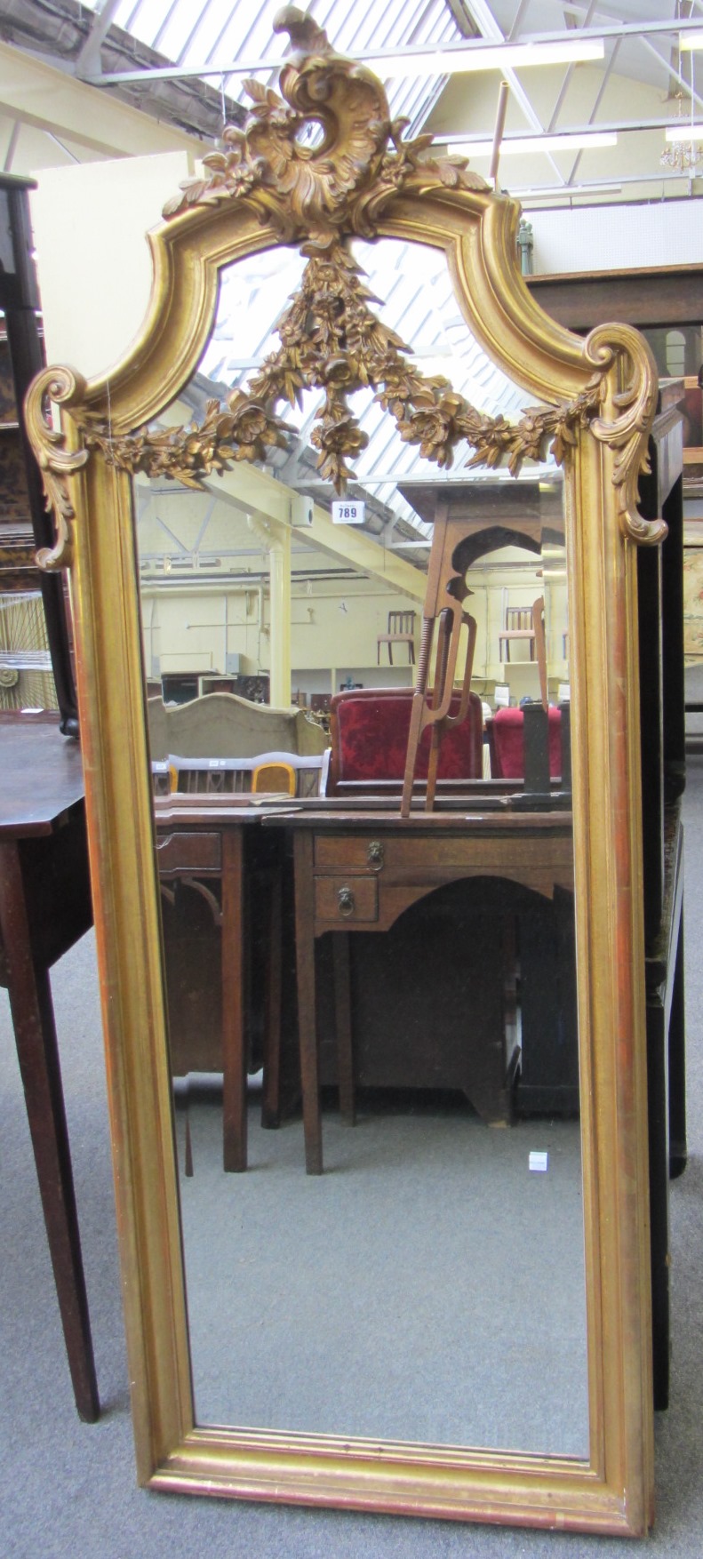 Appraisal: A Victorian gilt framed overmantel mirror with 'C' scroll crest