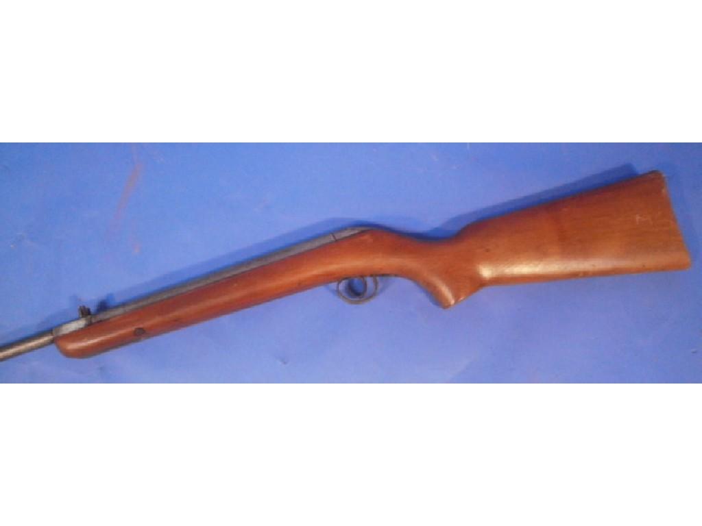 Appraisal: An air rifle with oak stock stamped with Serial No