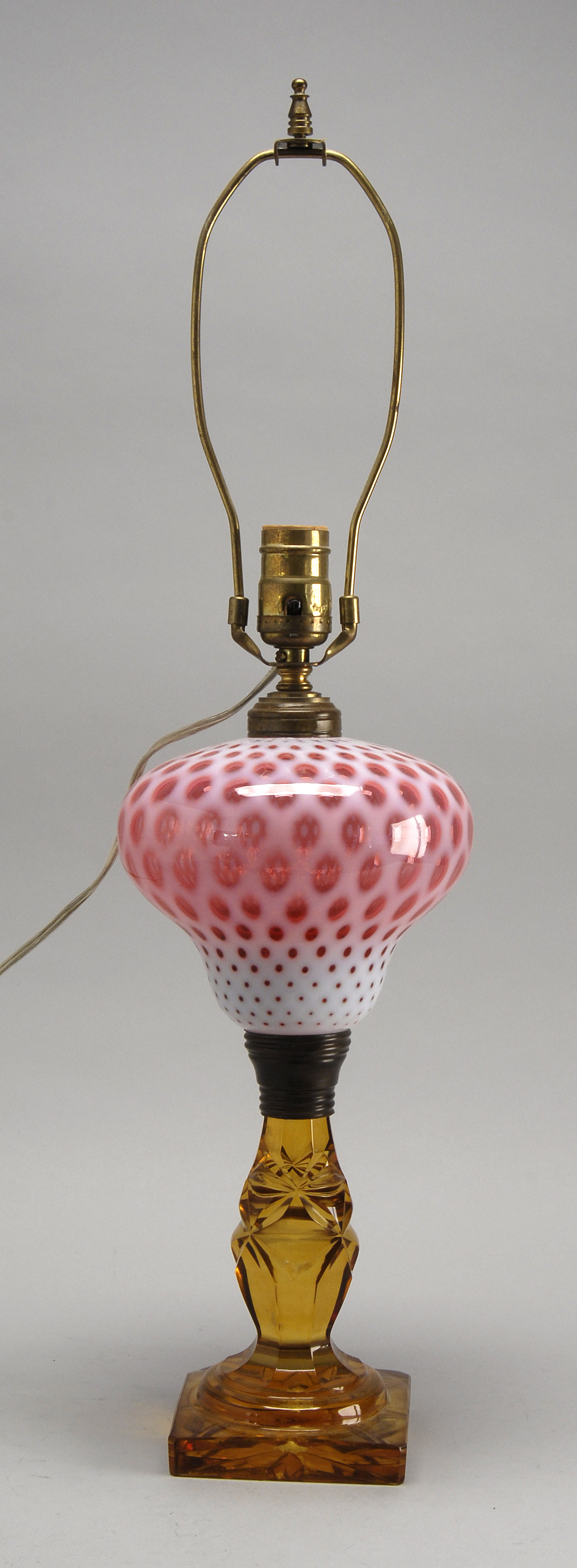 Appraisal: EARLY TH CENTURY FLUID LAMP with opaque white and cranberry