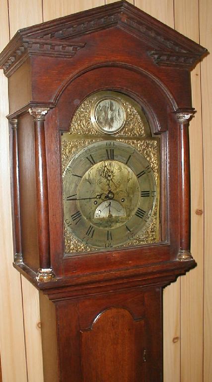 Appraisal: An thC oak longcase clock with dentil moulded and column