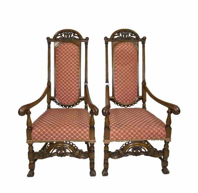 Appraisal: A pair of walnut upholstered armchairs of Carolean design with