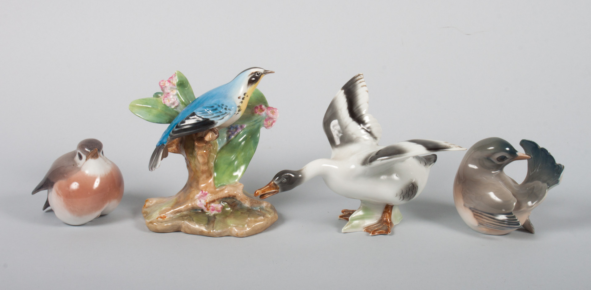 Appraisal: Four porcelain and china birds including Royal Doulton china Yellow