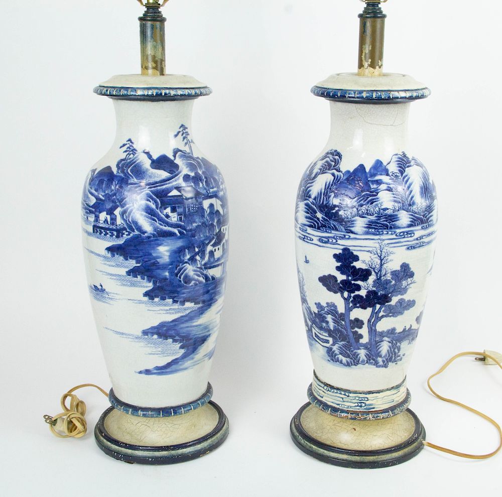 Appraisal: A Pair of Soft Paste Blue White Landscape Vases Drilled