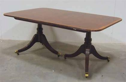 Appraisal: Regency style mahogany double pedestal dining table baker furniture th