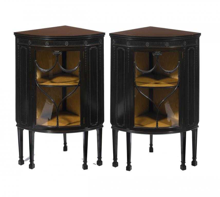 Appraisal: A PAIR OF EDWARD VII MAHOGANY BOW FRONTED CORNER CABINETS