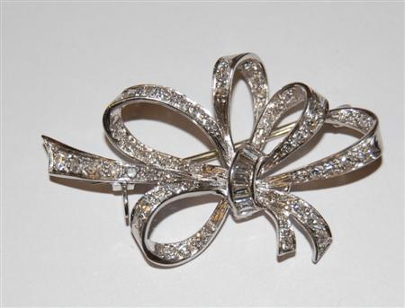 Appraisal: A ct white gold and platinum diamond set bow form