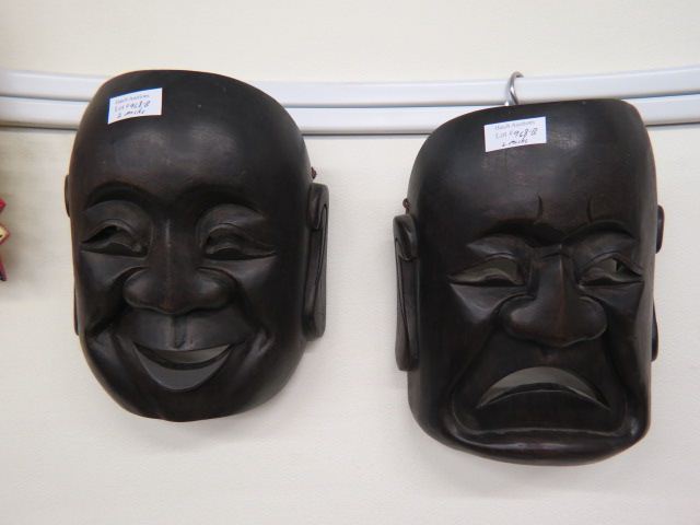 Appraisal: Oriental Carved Wooden Masks happy sad faces ying yang each