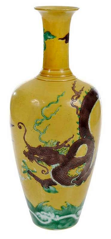 Appraisal: Chinese Vase with Dragon Qing dynasty slender yellow vase with