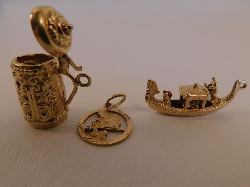 Appraisal: K GOLD CHARMS - NARDI GONDOLA Three assorted K gold