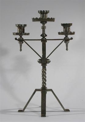 Appraisal: A Gothic Revival polished steel candlestick on flaring foot the