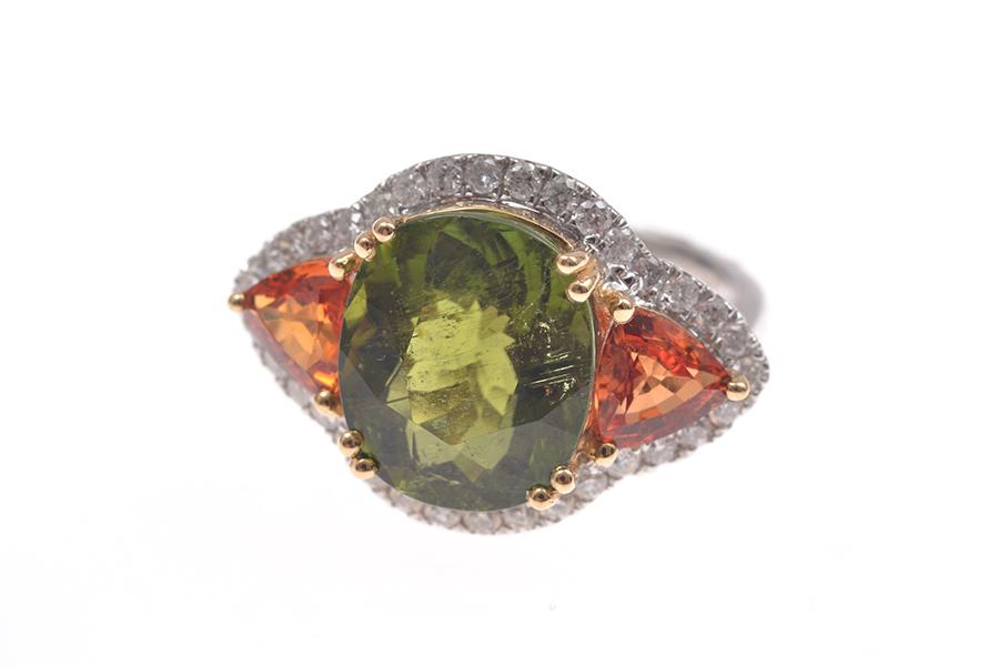 Appraisal: A GREEN TOURMALINE ORANGE SAPPHIRE AND DIAMOND DRESS RING IN