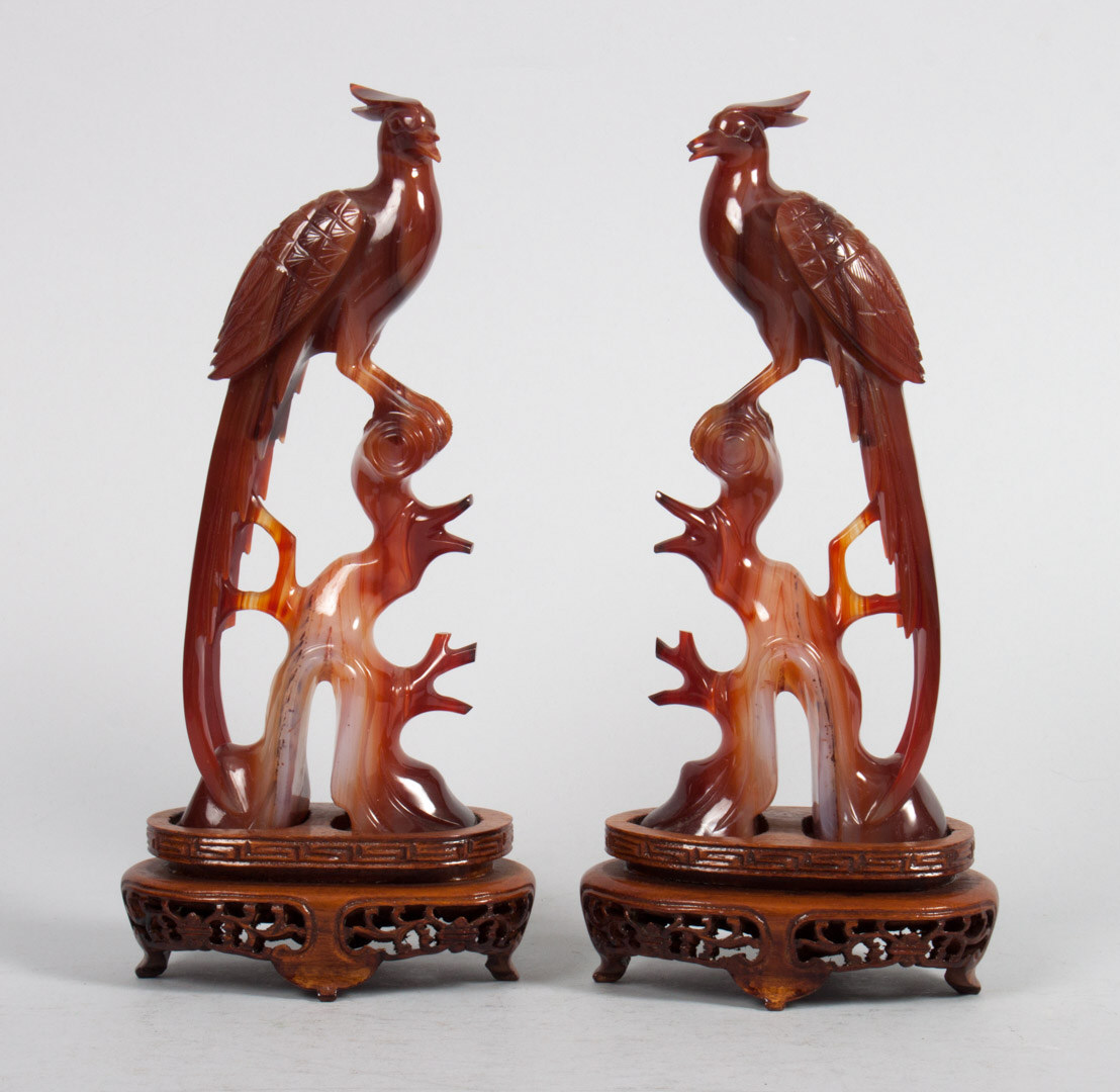 Appraisal: Pair of Chinese carved hardstone phoenixes modeled as phoenix perched