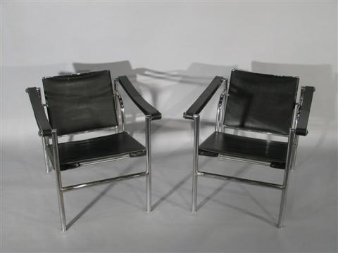 Appraisal: PAIR LE CORBUSIER STYLE BASCULANT ARMCHAIRS Mid th century each