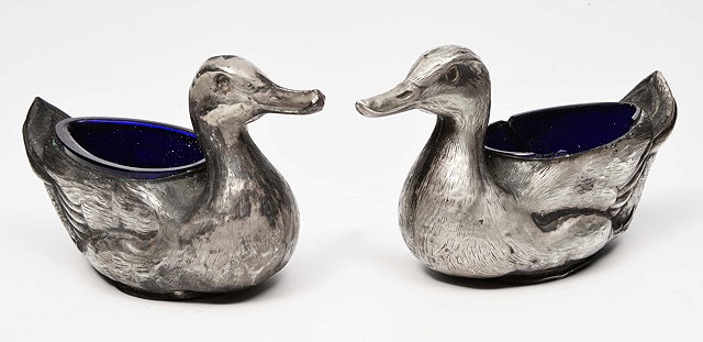 Appraisal: A PAIR OF EDWARDIAN LOADED SILVER SALTS in the form