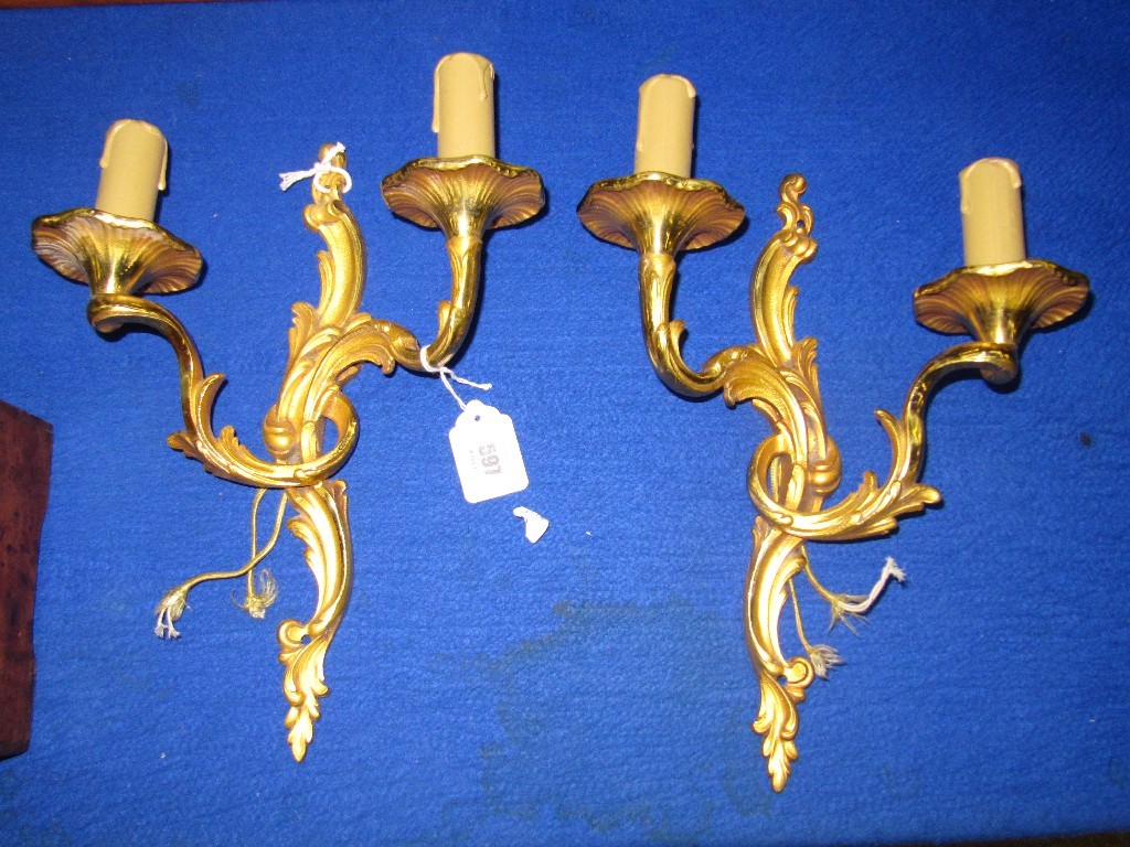 Appraisal: Pair of gilded metal wall lights