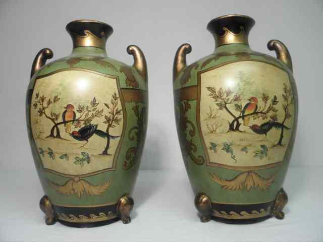 Appraisal: Pair of hand painted decorative ceramic urns Both are decorated