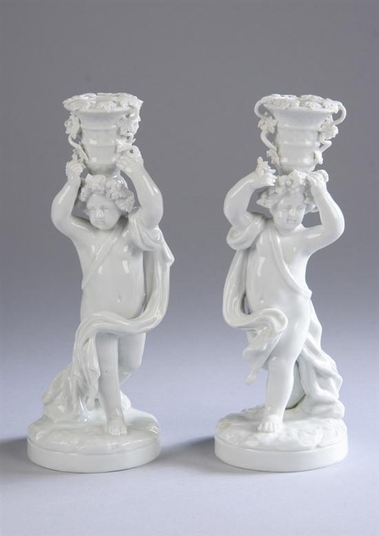 Appraisal: PAIR CONTINENTAL PORCELAIN FIGURAL CANDLESTICKS early th century unmarked Each