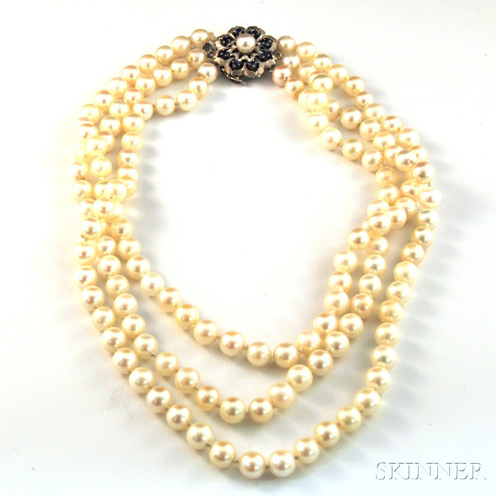 Appraisal: Triple-strand Cultured Pearl Necklace the ivory-colored pearls with blush overtones