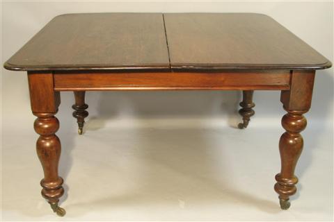 Appraisal: ENGLISH WALNUT EXTENSION DINING TABLE th century the rectangular top