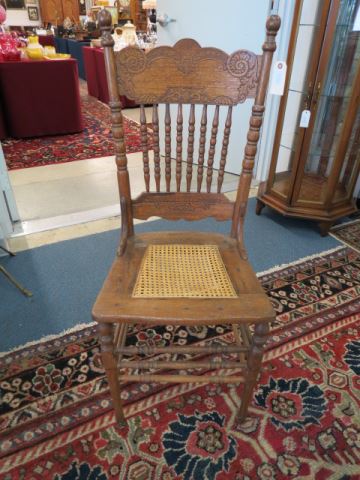 Appraisal: Oak Chair spindle and pressed back decor cane seat circa