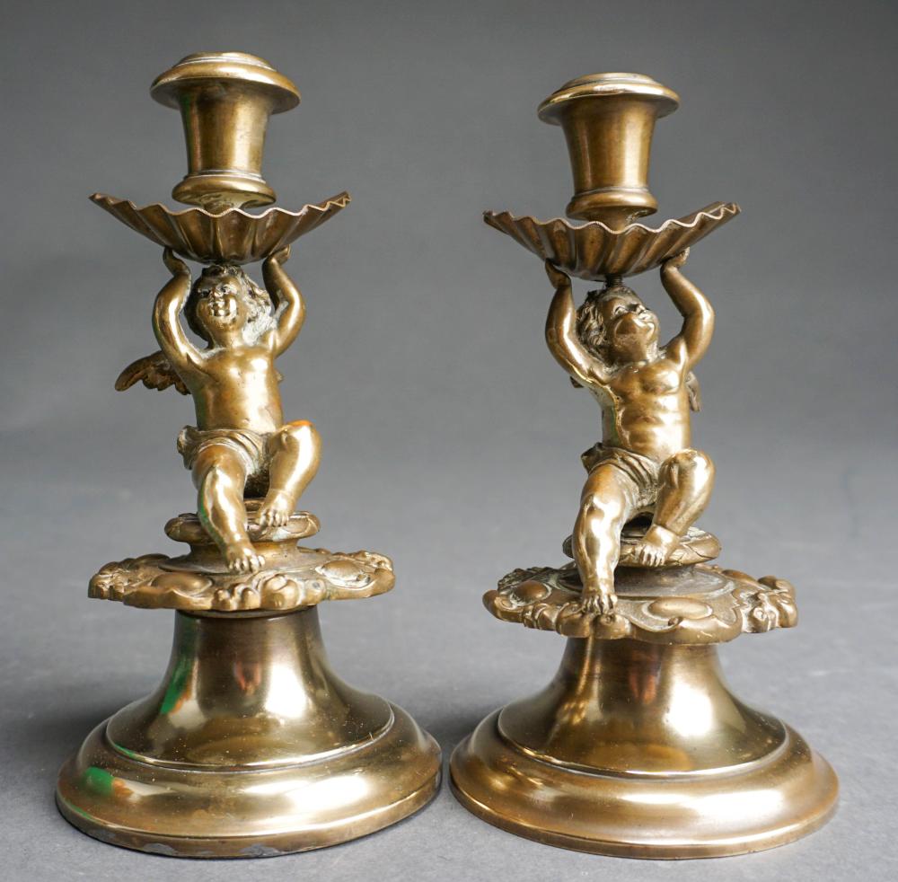 Appraisal: PAIR OF LOUIS XVI STYLE BRONZE PUTTI-FORM CANDLEHOLDERS H IN