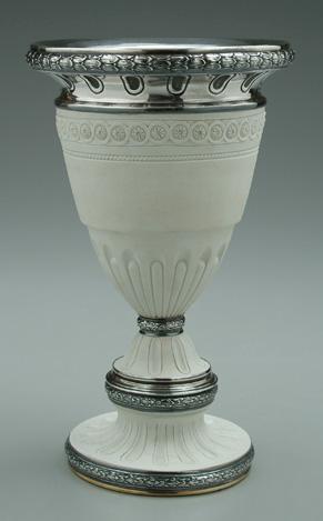 Appraisal: Porcelain silver urn unglazed with classical style border decoration and