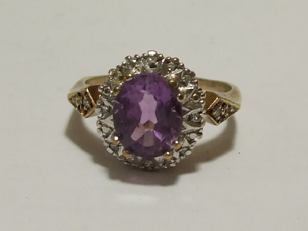 Appraisal: Nine carat gold amethyst and diamond cluster ring