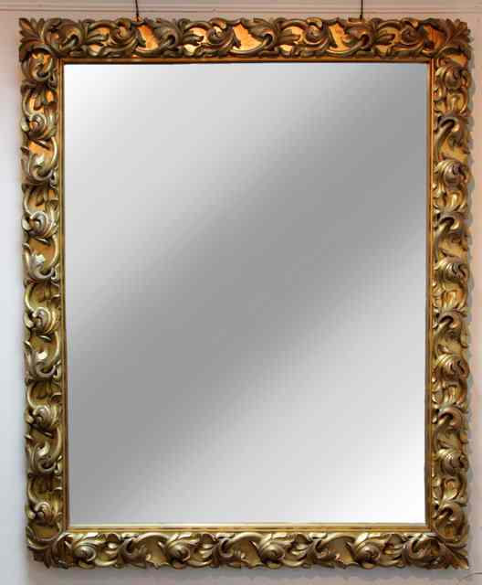 Appraisal: A rectangular wall mirror in a Florentine carved gilt wood