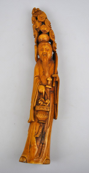 Appraisal: Chinese ivory carving of a standard mortal holding a fly