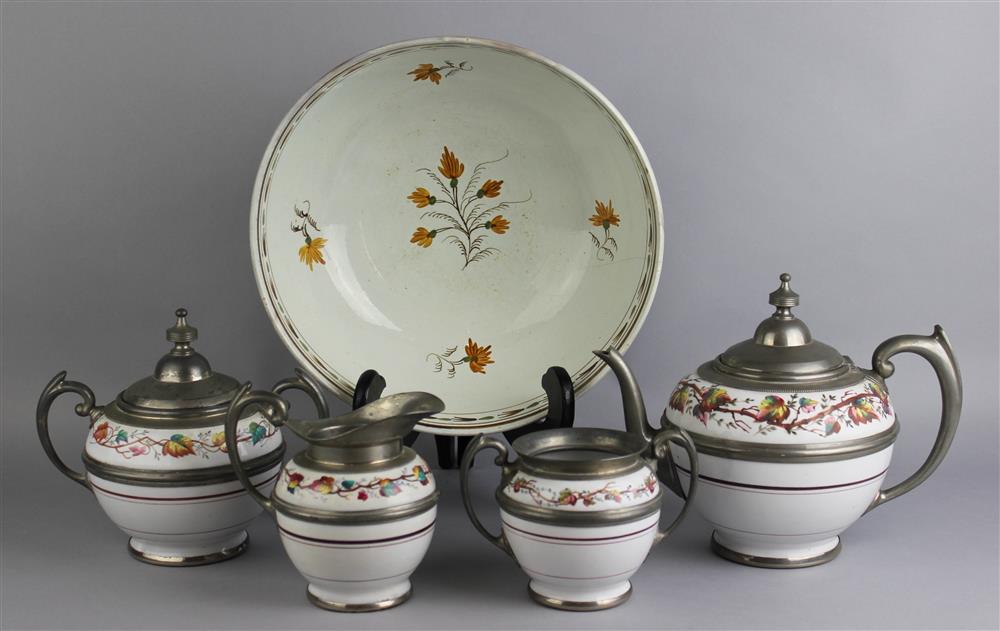 Appraisal: ENGLISH PEARLWARE PUNCH BOWL AND FOUR PEWTER MOUNTED TEA WARES