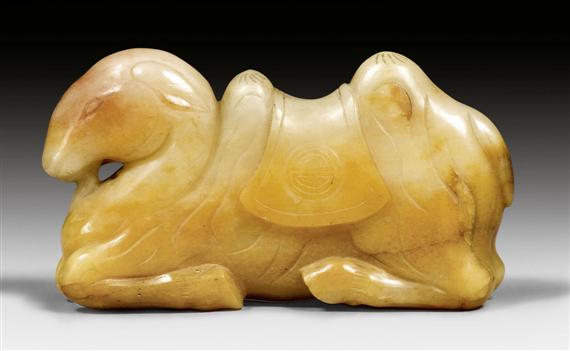 Appraisal: A CARAMEL COLOURED RECUMBENT JADE CAMEL China Qing dynasty or