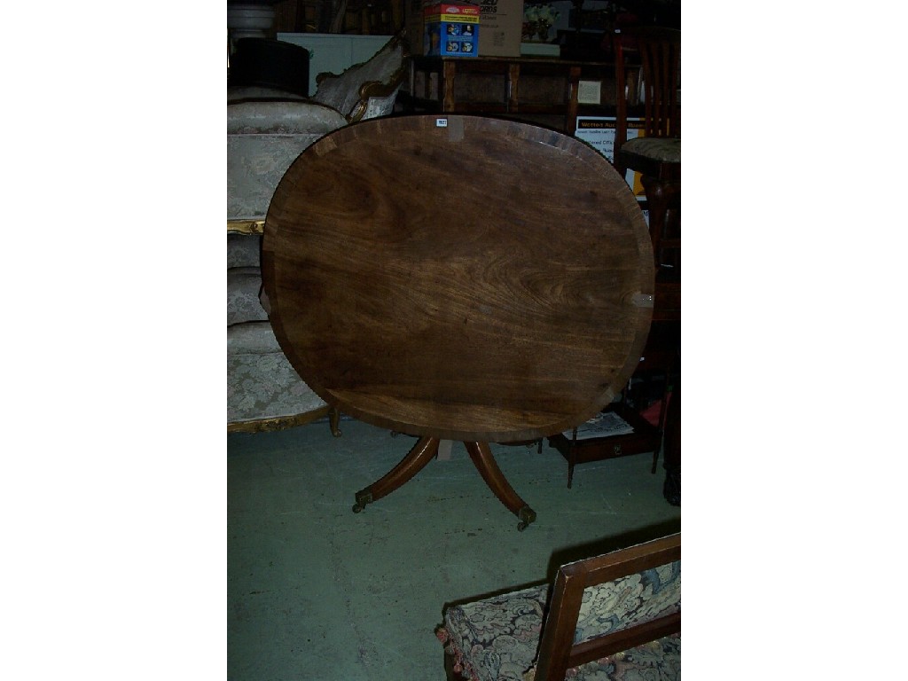 Appraisal: A Regency mahogany breakfast table the oval top with cross