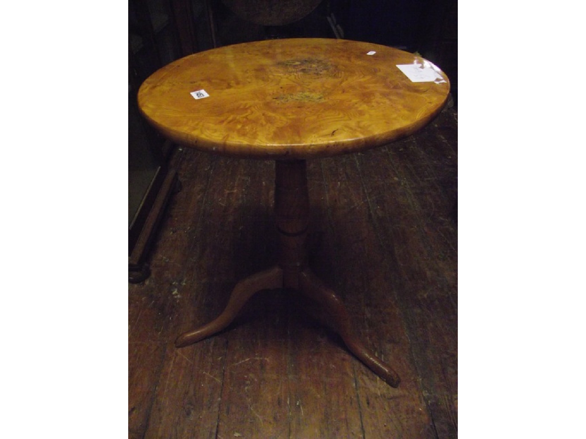 Appraisal: A Biedermeier occasional table in figured birchwood raised on a