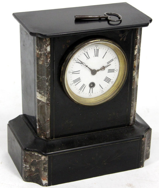 Appraisal: A black slate mantel clock the circular dial with Roman