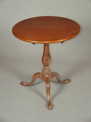 Appraisal: A mahogany circular tripod table th century with a baluster