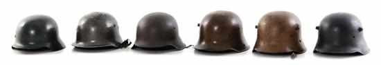 Appraisal: German and Austrian combat helmets German M interior back marked