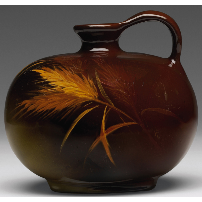 Appraisal: Weller Louwelsa handled vessel brown glaze with a painted wheat