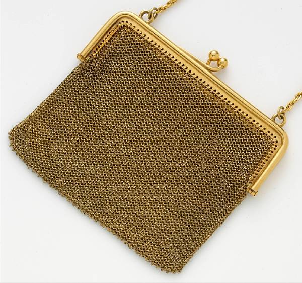 Appraisal: An eighteen karat gold mesh purse opening to reveal two