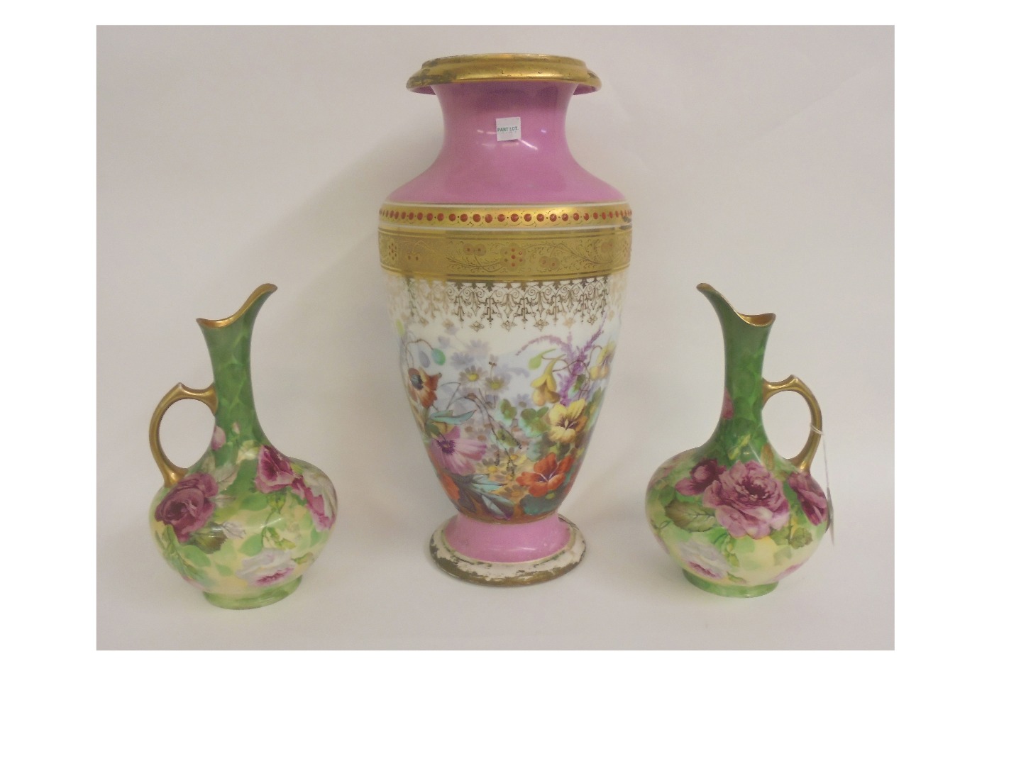 Appraisal: A pair of Limoges Art China ewers painted with roses