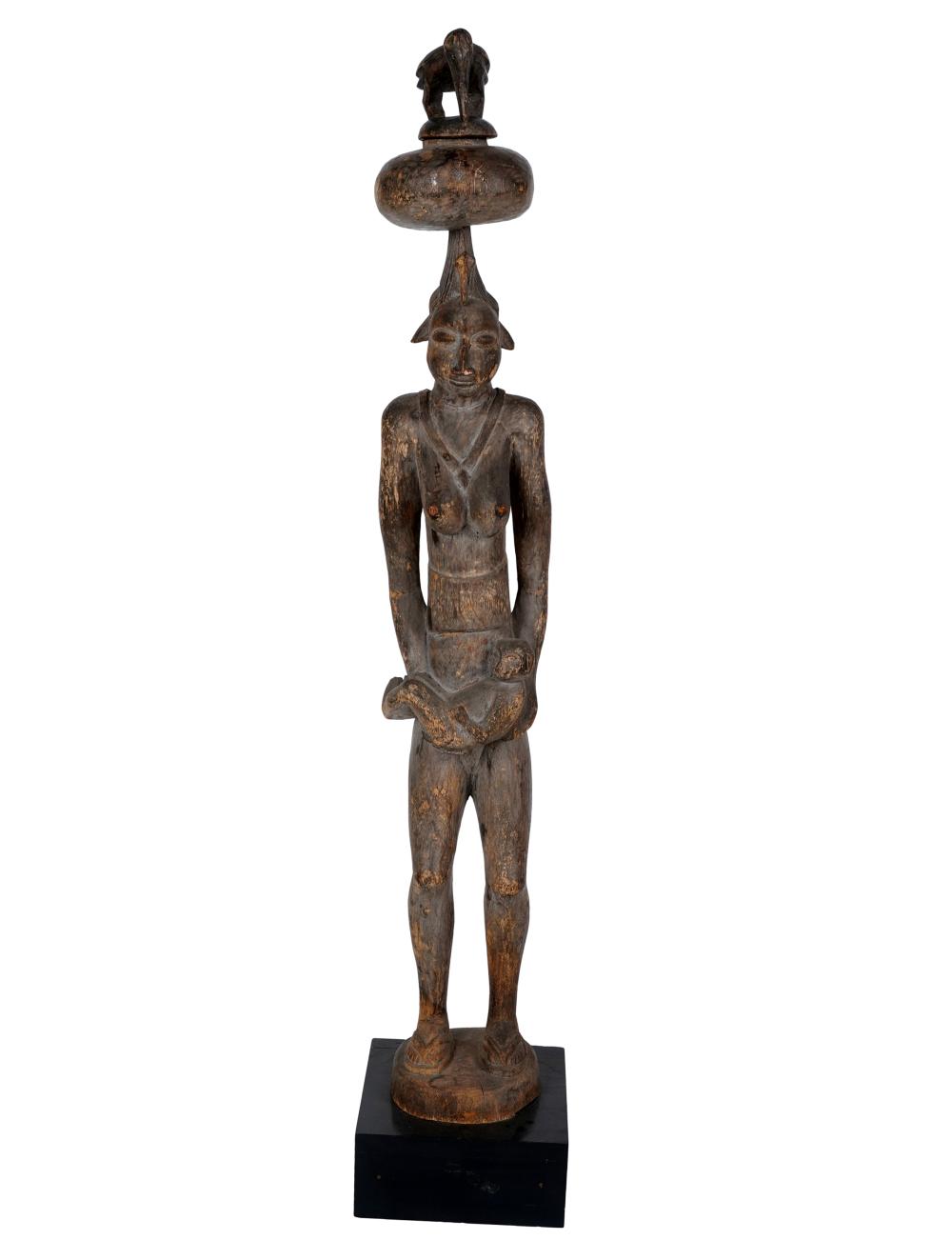 Appraisal: AFRICAN WOOD CARVING ON STANDwith removable bird finial on a