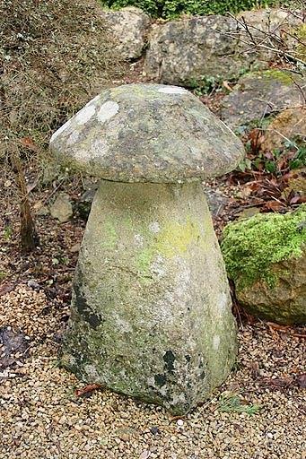 Appraisal: A staddle stone with a circular top and a tapered