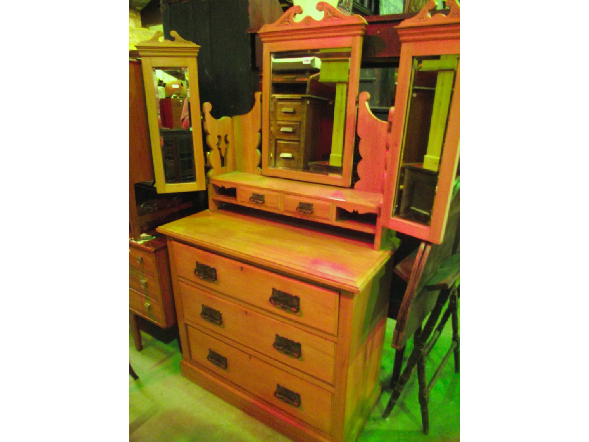 Appraisal: An Edwardian satin walnut dressing chest with triple mirror back